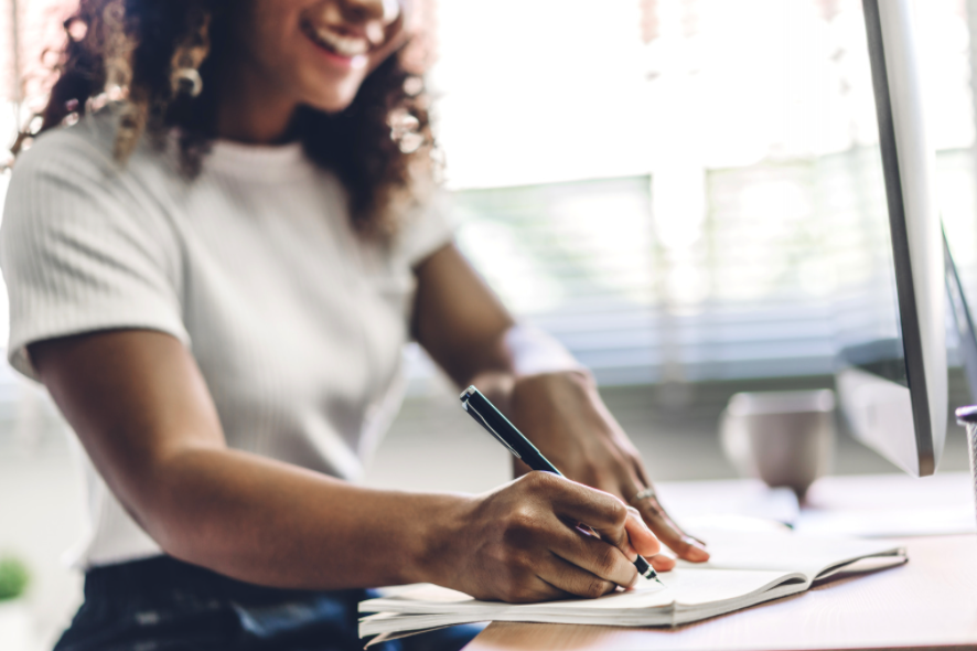 Woman writing on her laptop