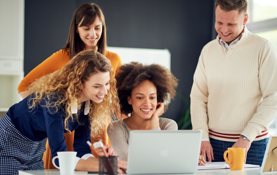 Group of people working on a laptop