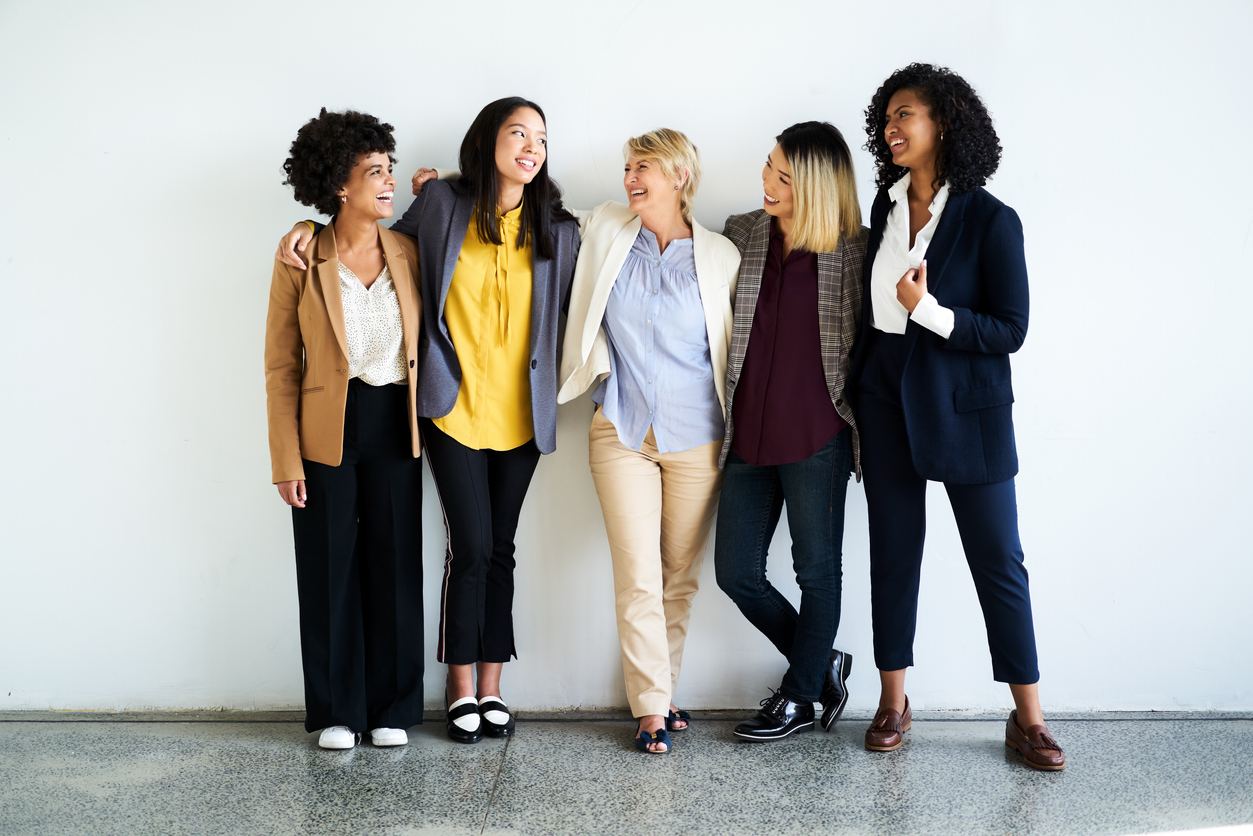 5 businesswomen standing together.
