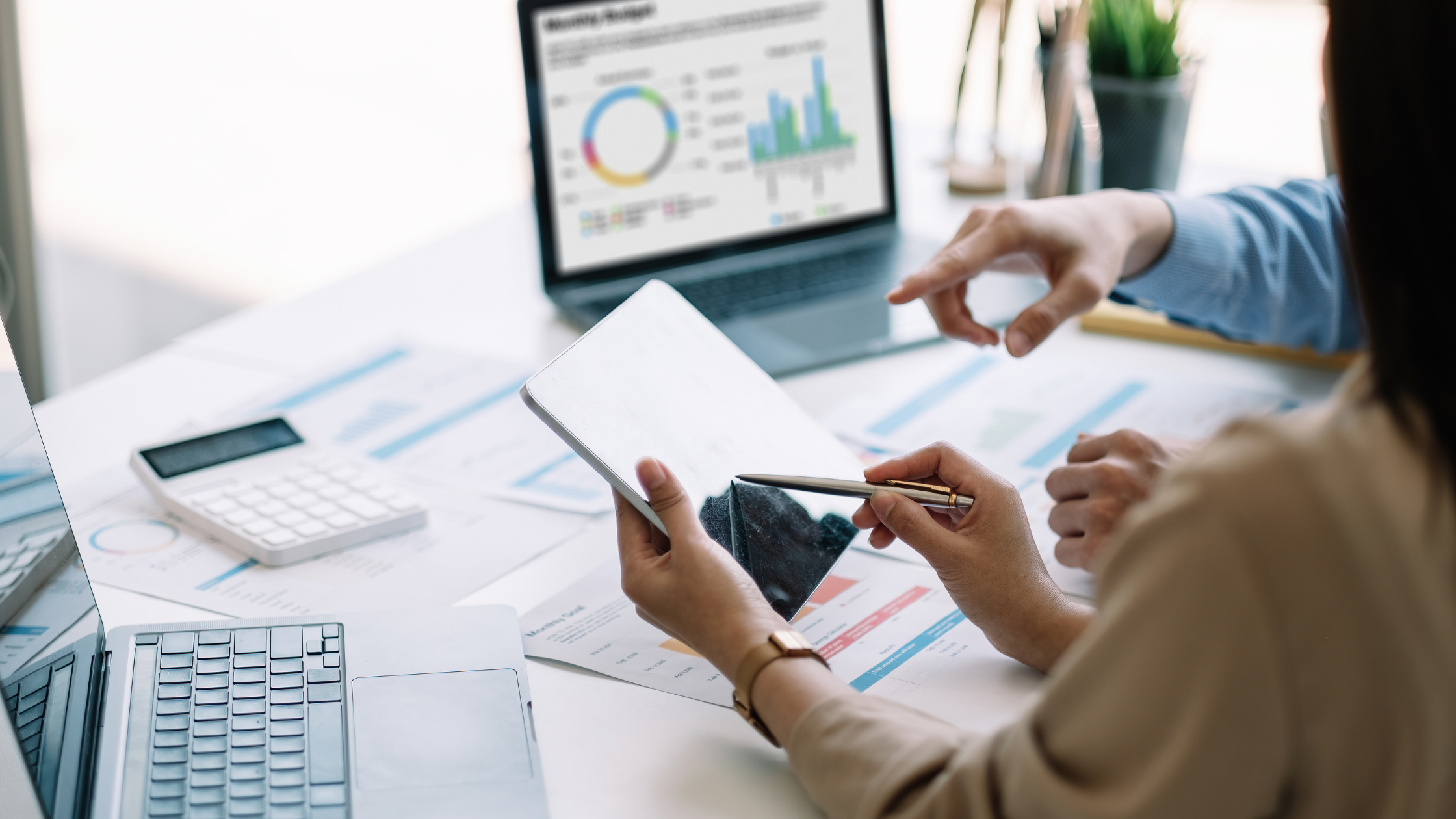 What is Melio | Reviewing financials on a tablet