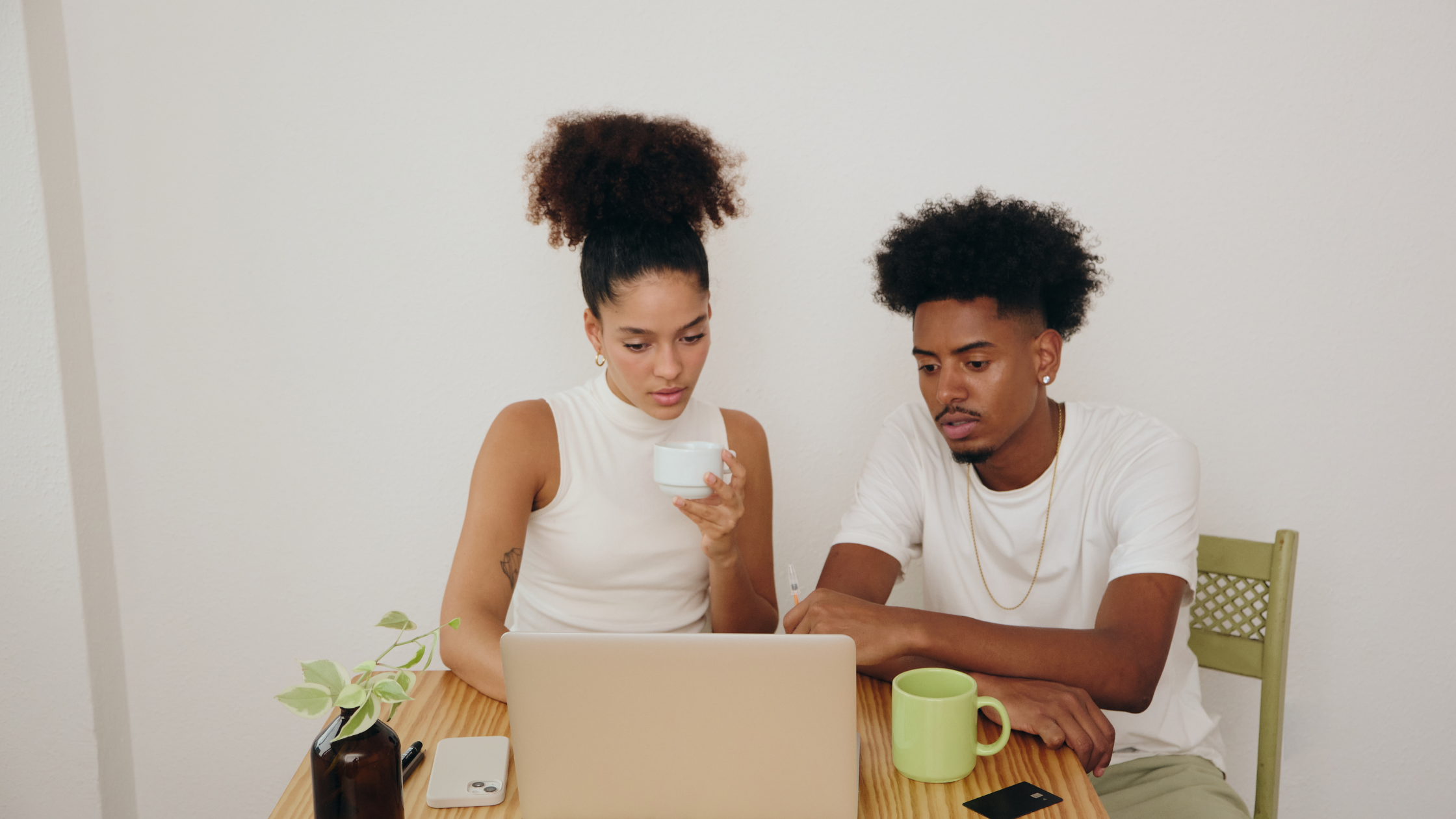 Two business owners at laptop