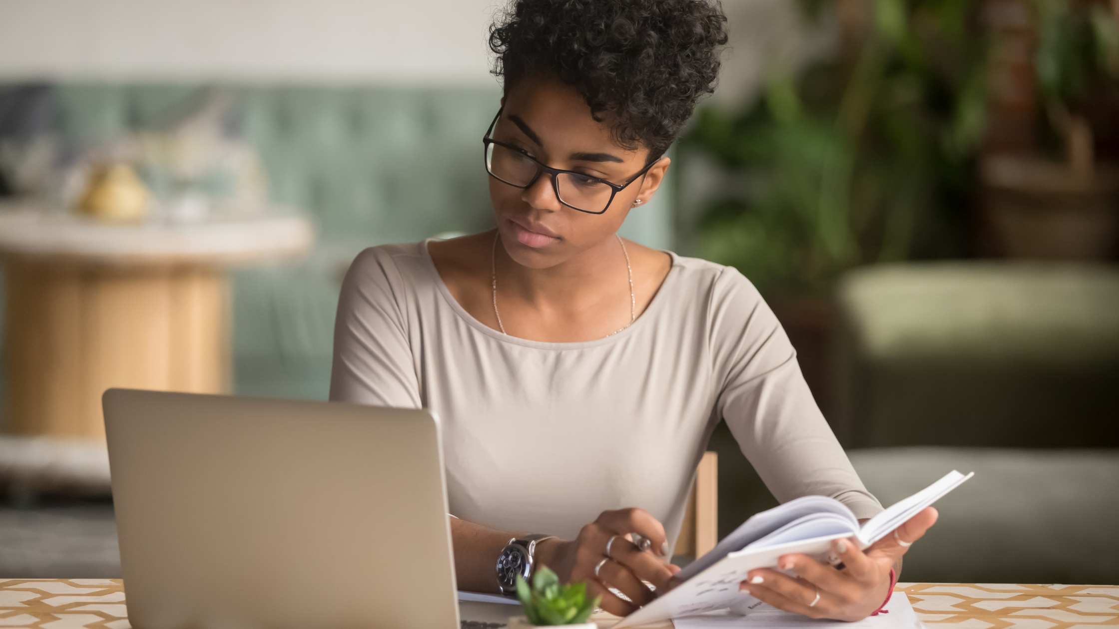 What is Entrepreneurship Through Acquisition? | Woman holding a notebook