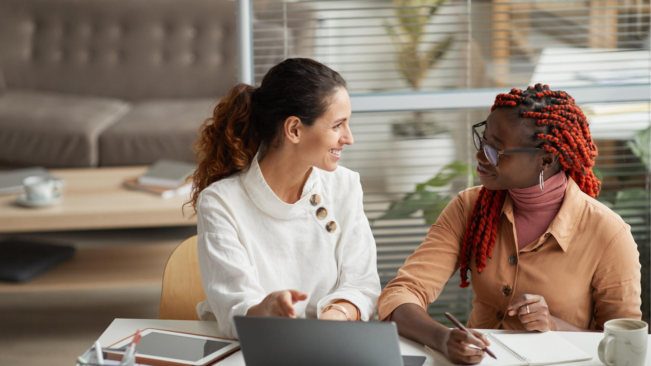 Your Guide to Buying a Small Business | Two women at a desk