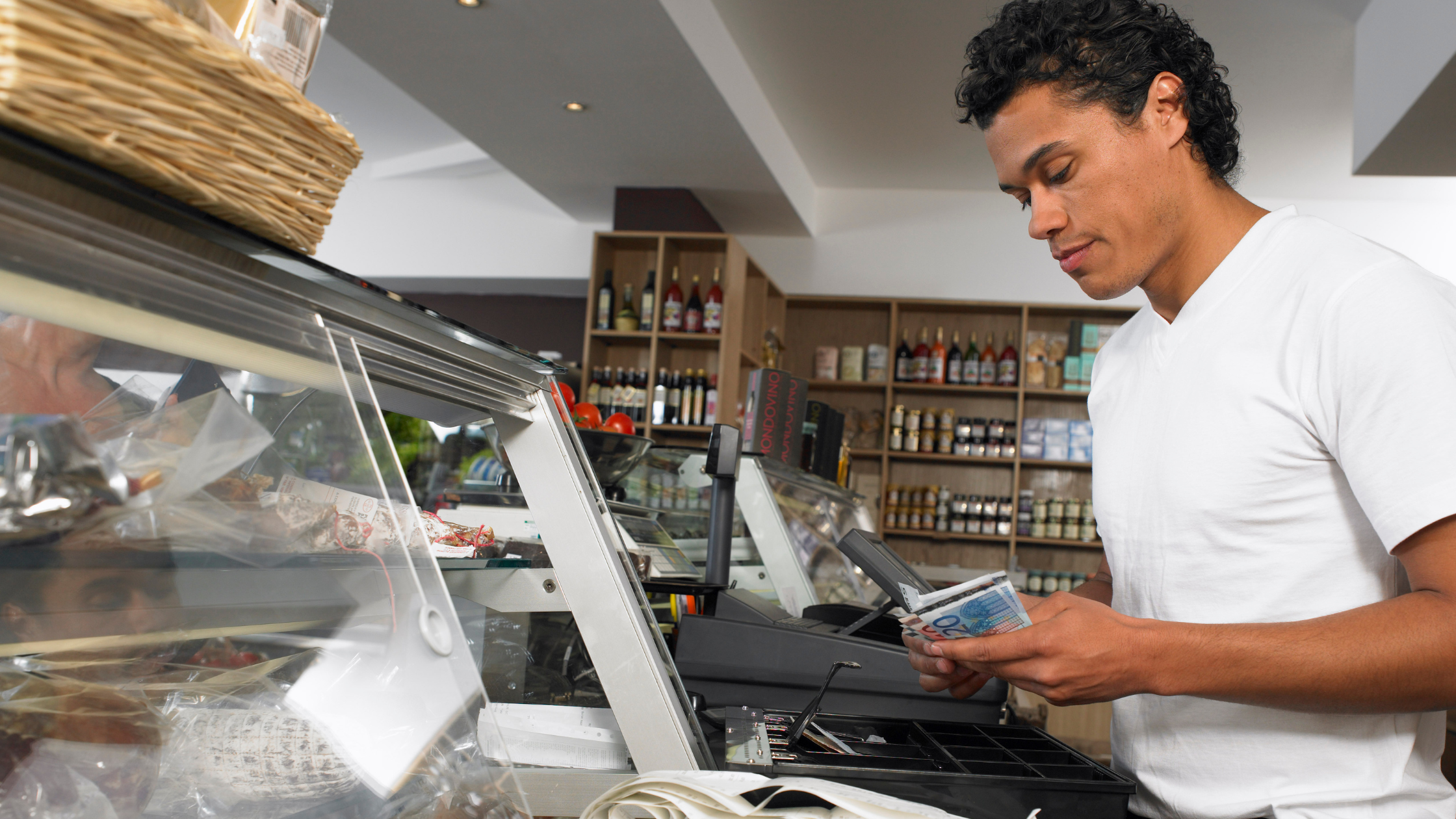 A Guide to Merchant Cash Advances for Small Business Owners | Owner at register 