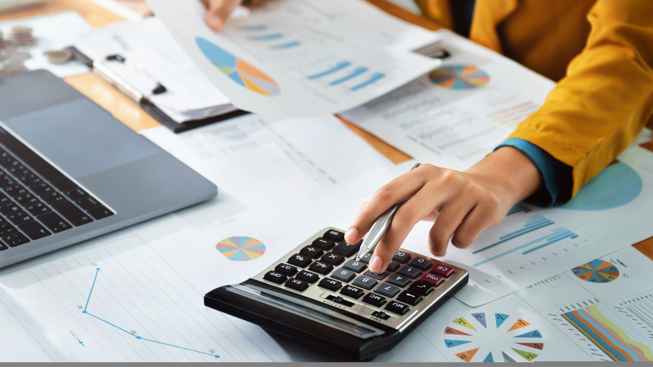 Should I Hire an Accountant for My Small Business? | Hand typing on a calculator