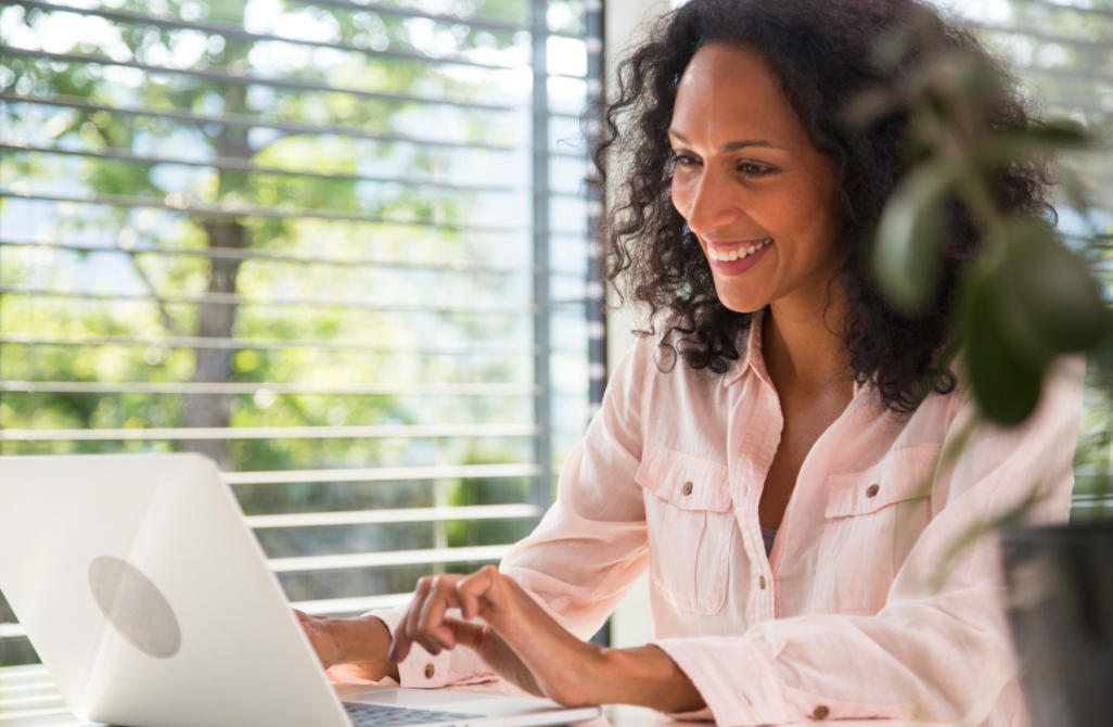 Woman working on a laptop.