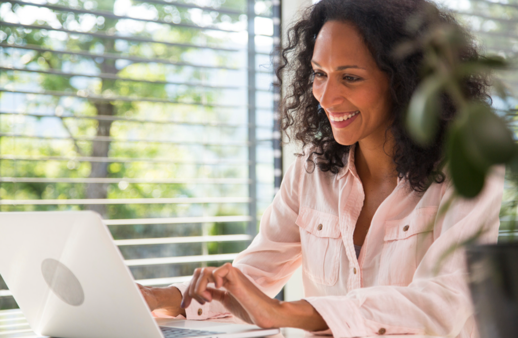 Woman working on a laptop. 