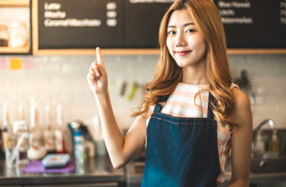 women pointing at coffee shop