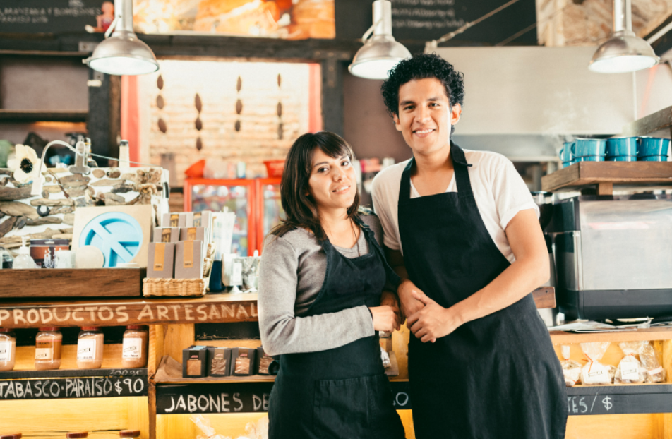 man and women smiling in a shop