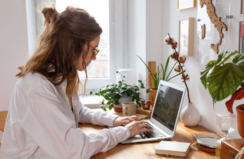 woman sitting at computer typing