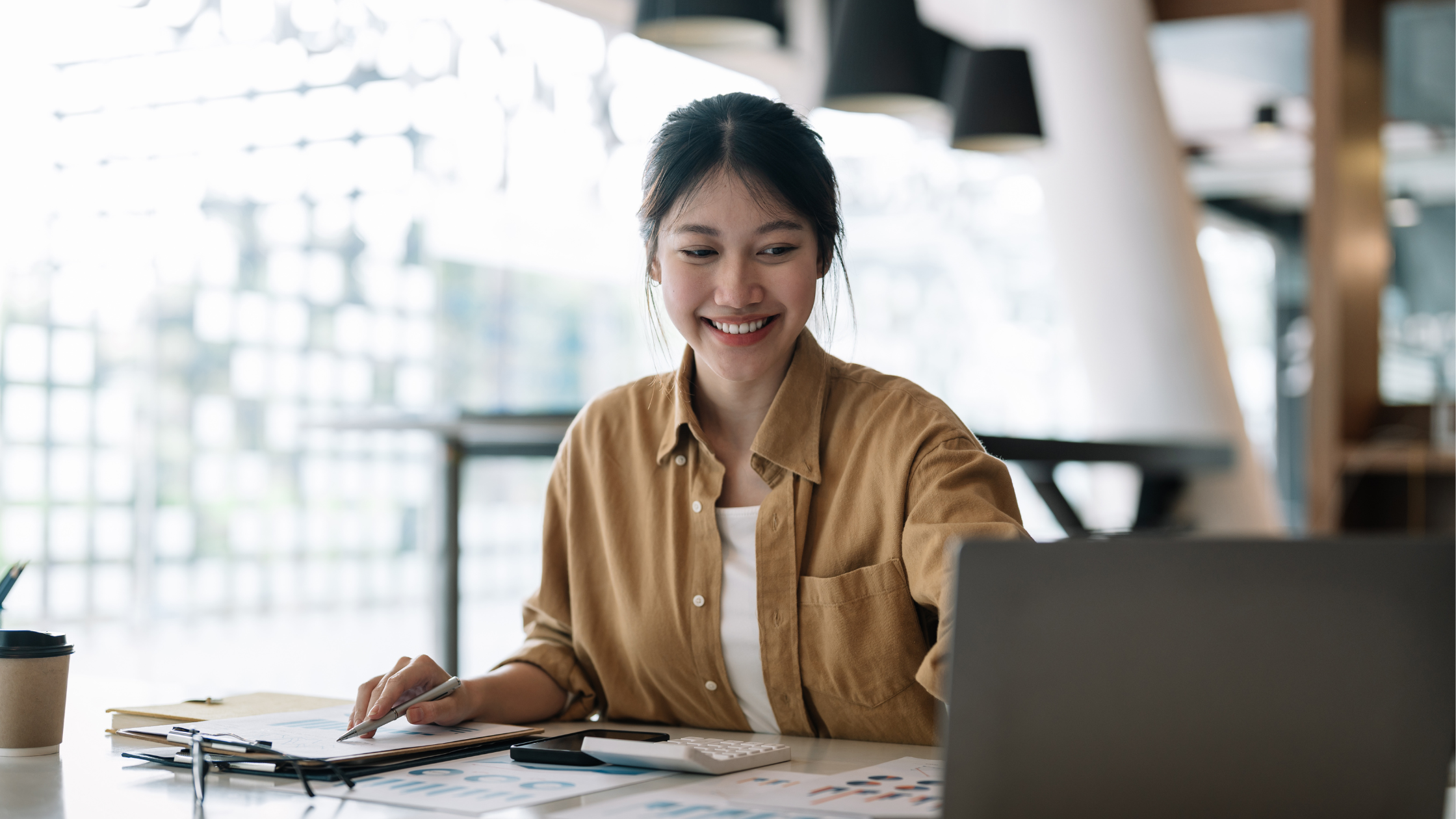 Difference Between an Accountant and a Bookkeeper | Woman at Laptop