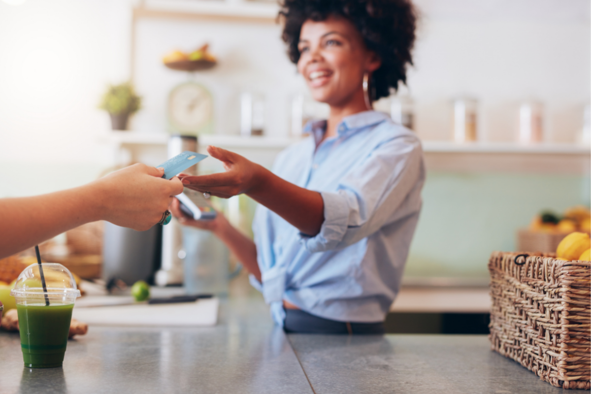 Women collecting payment from a customer.