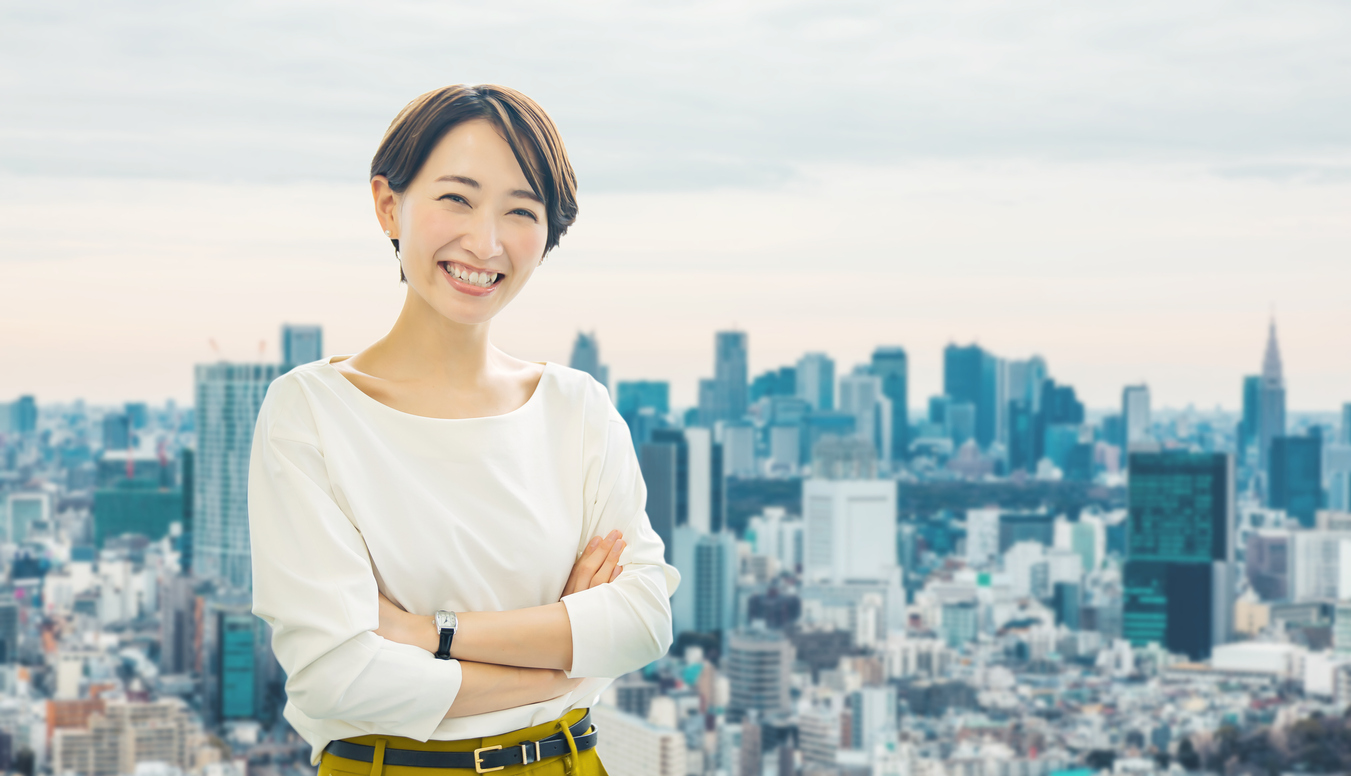 Woman standing in front of a city.