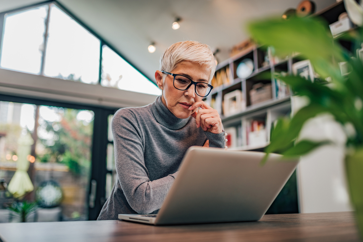 Woman working on laptop.