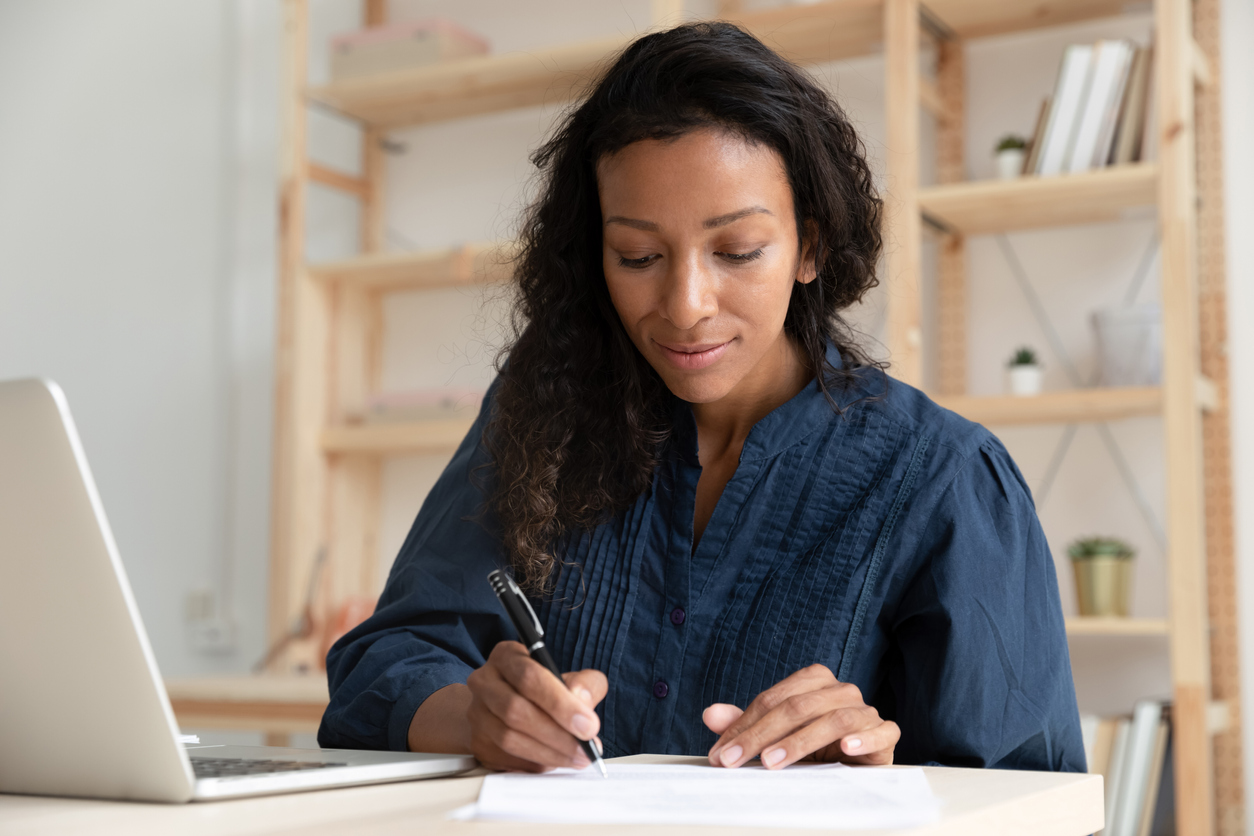 Woman writing notes.  